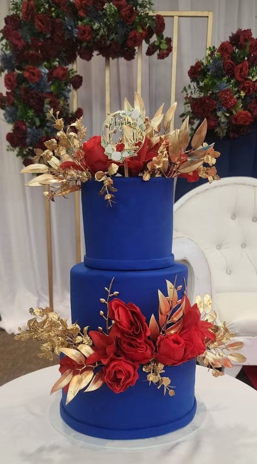 Original royal blue and red floral celebration cake by Sweet Magical Creations